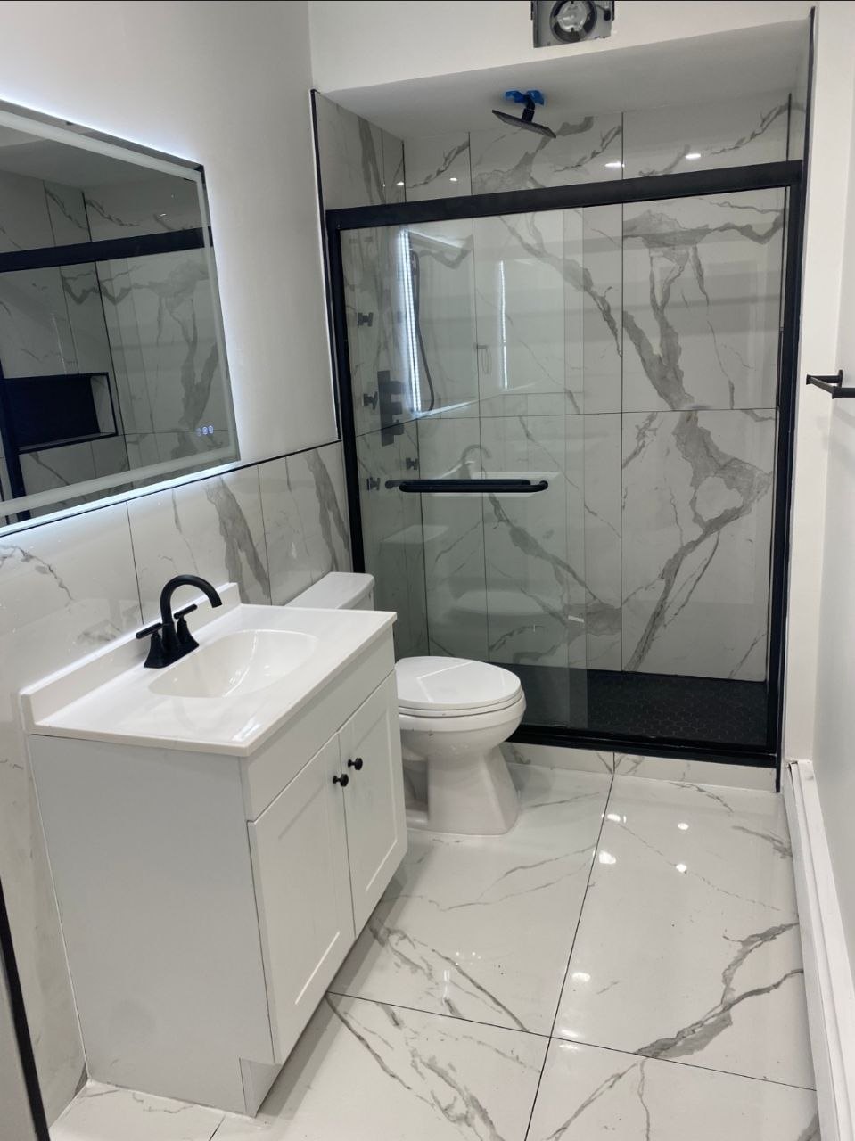 Bathroom Remodel — Marble Tile & Black Fixtures