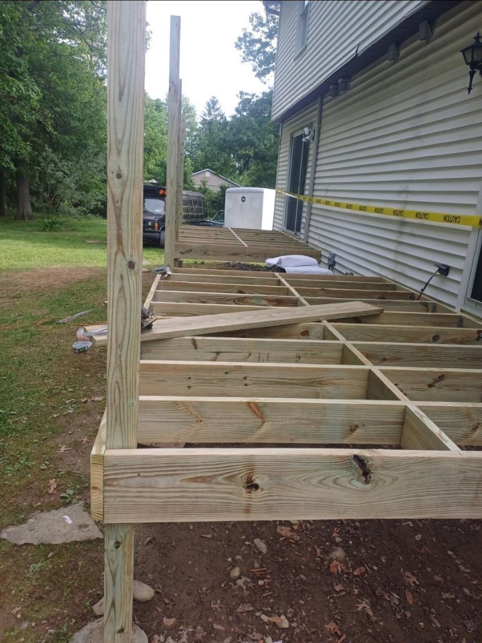 New deck framing with joists and support posts — J&R Enterprise project