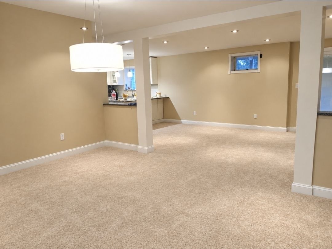 Finished basement dining room with modern chandelier — J&R Enterprise project