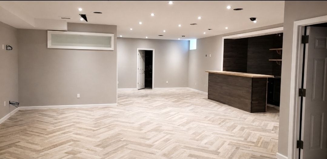 Basement with bar after — J&R Enterprise renovation